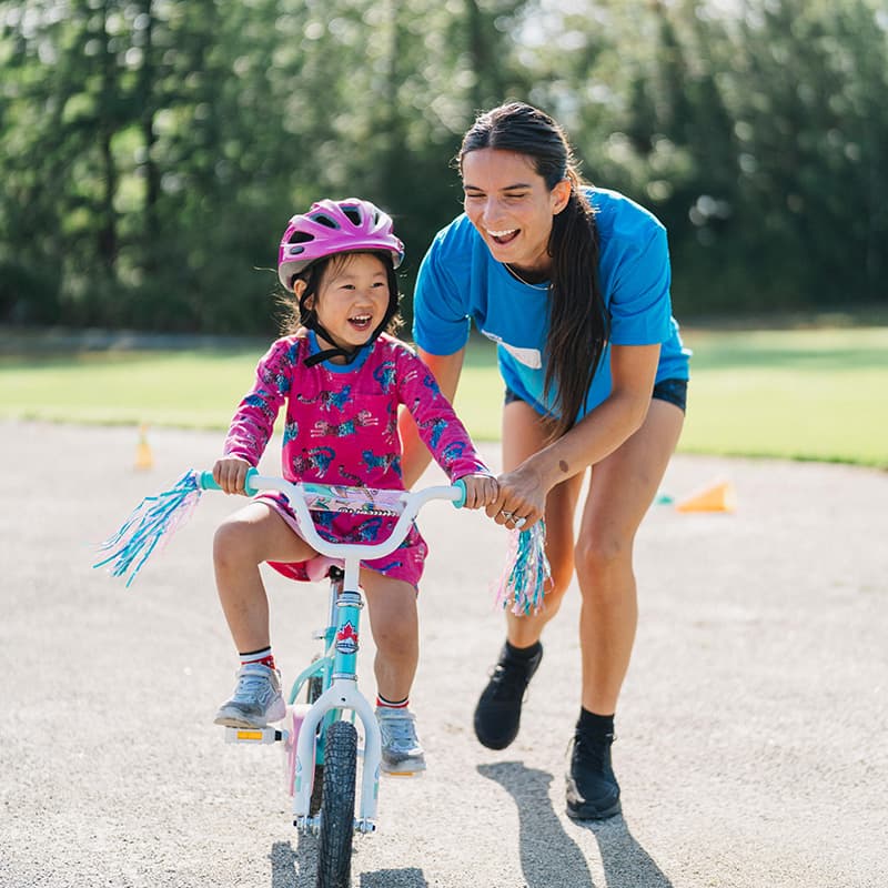 pedalheads camper learning how to ride at bike camp