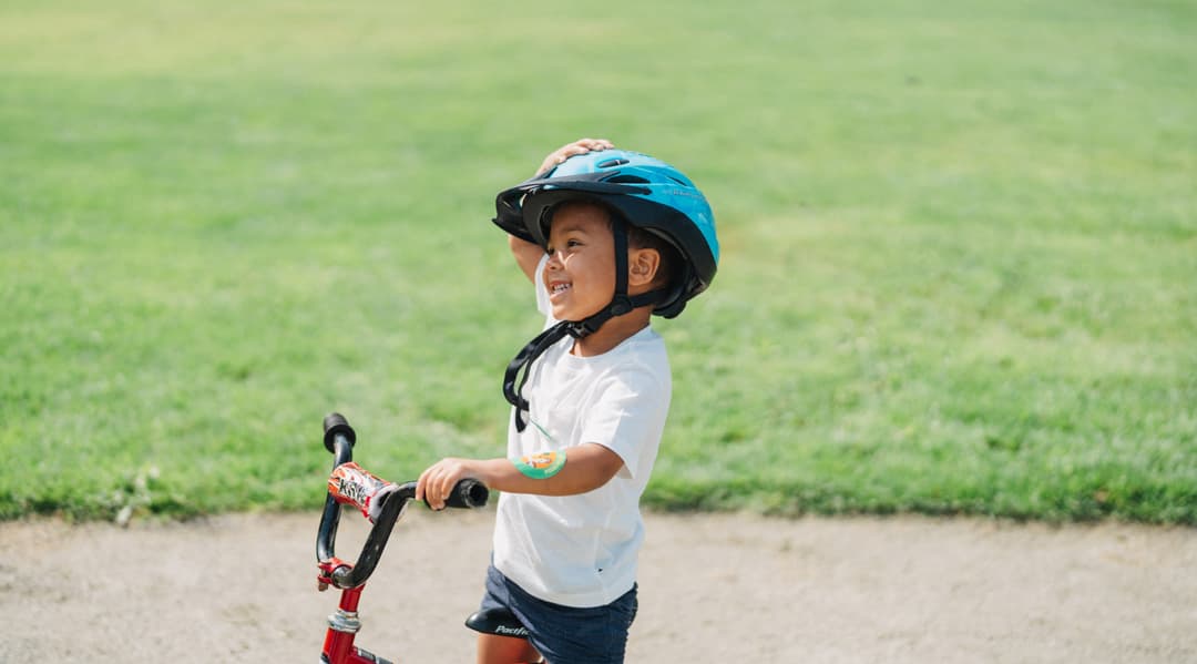 boy happy at bike camp