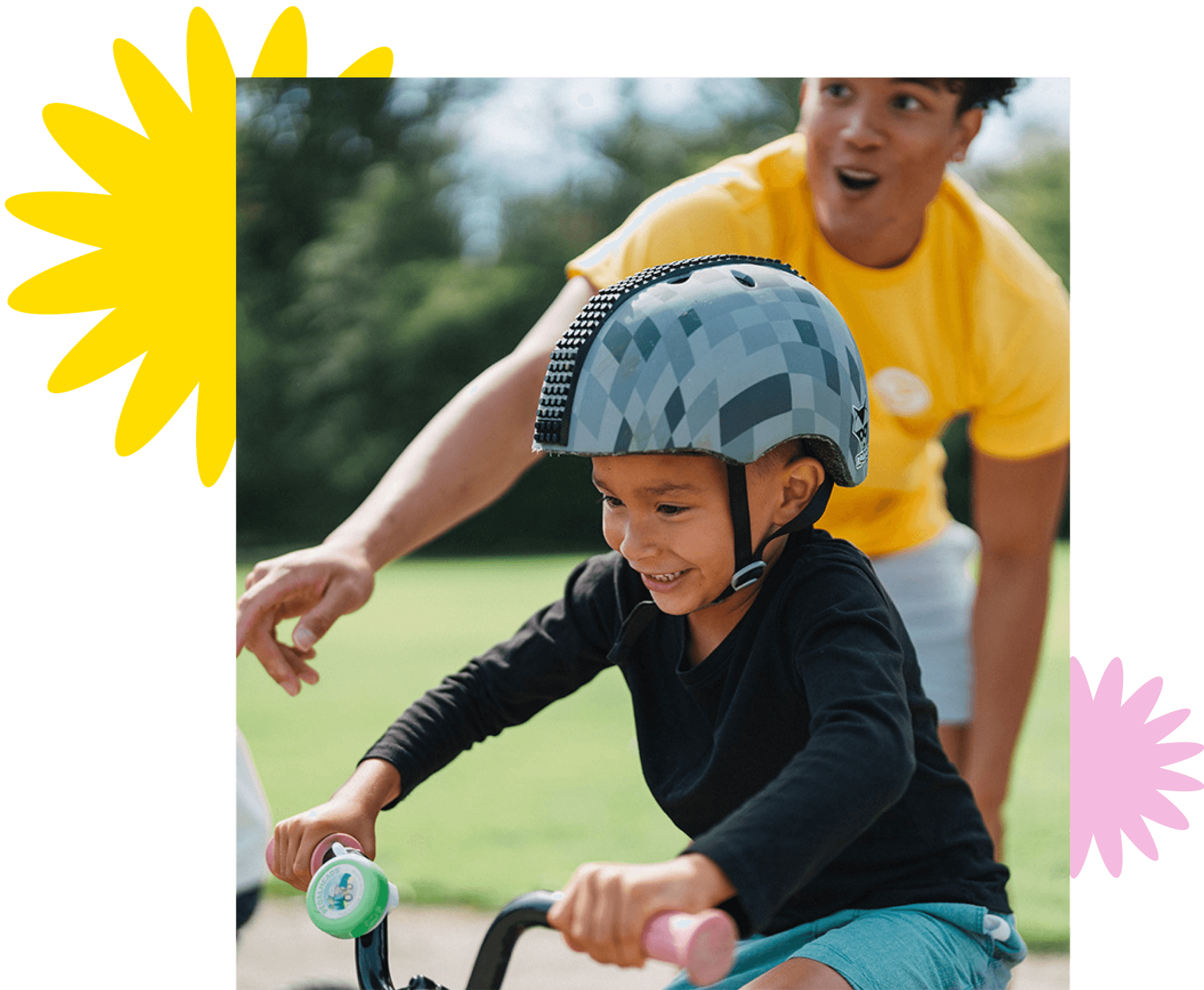 instructor with kid on bike at bike camp