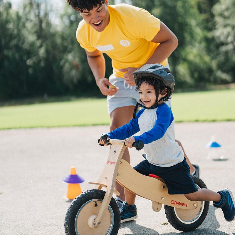 slider 1 toddler riding bike at pedalheads bike camp in boston