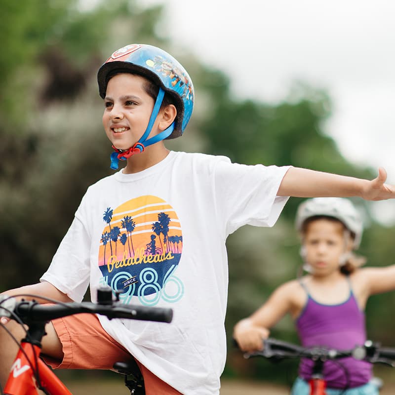 slider 1 boy learning road safety skills at manitoba summer camp